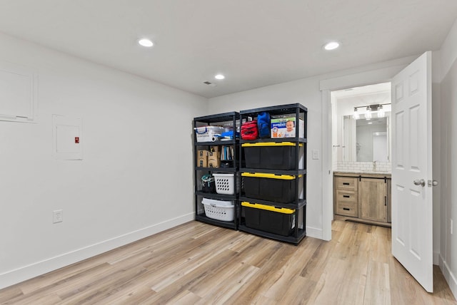 16814 N Tamarac Ln, Nine Mile Falls, WA 99026 - interior space featuring light wood finished floors, recessed lighting, electric panel, baseboards, and a sink