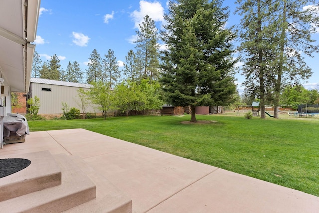 16814 N Tamarac Ln, Nine Mile Falls, WA 99026 - view of patio featuring a trampoline and a playground