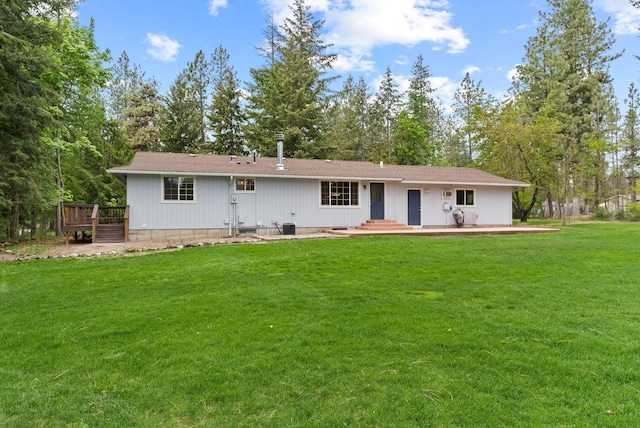 16814 N Tamarac Ln, Nine Mile Falls, WA 99026 - back of property with a wooden deck and a yard