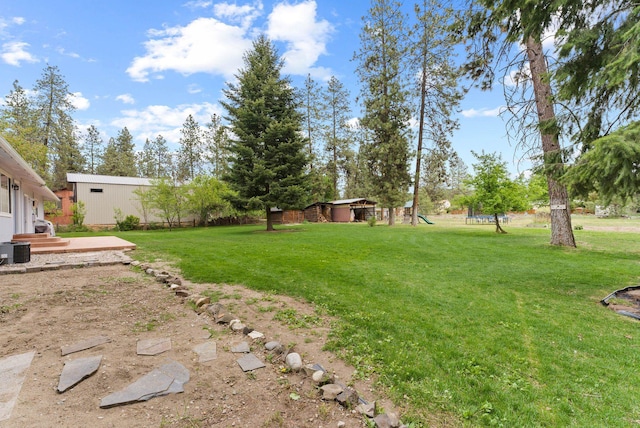 16814 N Tamarac Ln, Nine Mile Falls, WA 99026 - view of green lawn with a playground and cooling unit