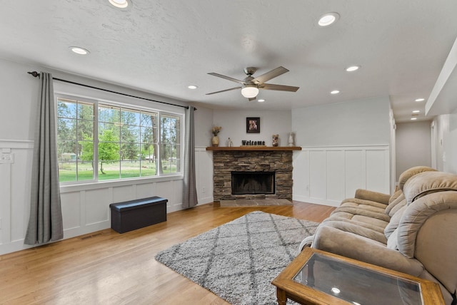 16814 N Tamarac Ln, Nine Mile Falls, WA 99026 - living area featuring a decorative wall, ceiling fan, recessed lighting, light wood-style flooring, and a wainscoted wall