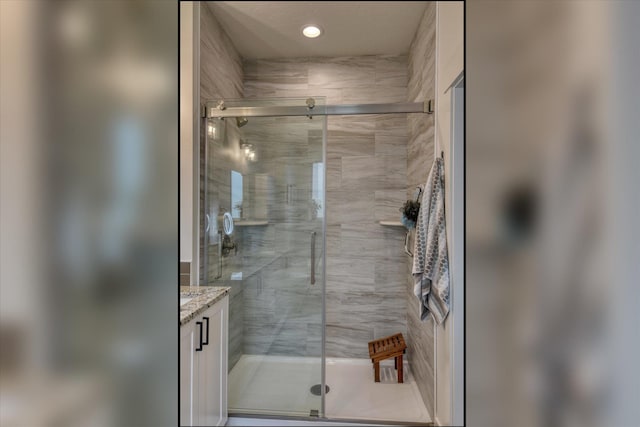 25523 N N Sheridan Rd, Chattaroy, WA 99003 - bathroom with a shower stall, vanity, and recessed lighting