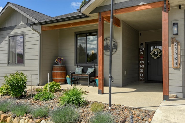 25523 N N Sheridan Rd, Chattaroy, WA 99003 - entrance to property featuring board and batten siding, a shingled roof, and a porch
