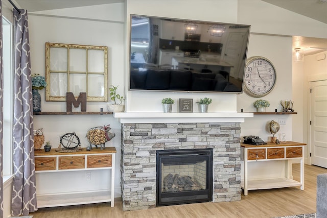 25523 N N Sheridan Rd, Chattaroy, WA 99003 - living room featuring wood finished floors and a fireplace