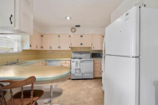 823 N Woodlawn Rd, Spokane Valley, WA 99216 - kitchen with white appliances, tile counters, a sink, tasteful backsplash, and recessed lighting