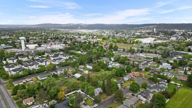 823 N Woodlawn Rd, Spokane Valley, WA 99216 - aerial view of property's location with mountains and nearby suburban area