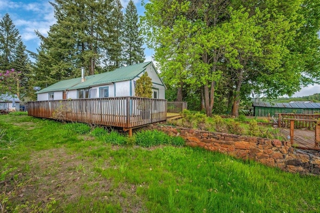 47 Davis Lake Ln, Usk, WA 99180 - view of side of home with a deck and metal roof