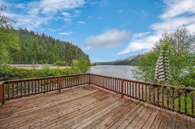 47 Davis Lake Ln, Usk, WA 99180 - wooden deck featuring a water view and a view of trees