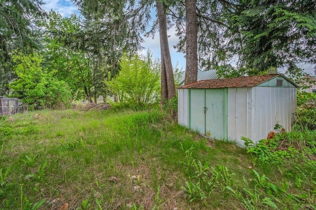 47 Davis Lake Ln, Usk, WA 99180 - view of yard featuring a shed and an outbuilding