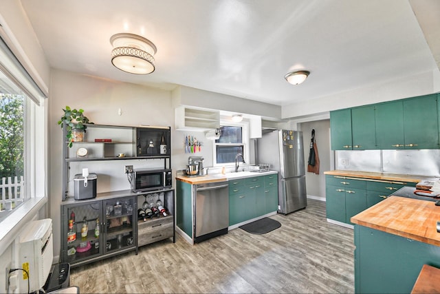 5420 N Regal St, Spokane, WA 99217 - kitchen featuring appliances with stainless steel finishes, wooden counters, light wood-style flooring, and baseboards