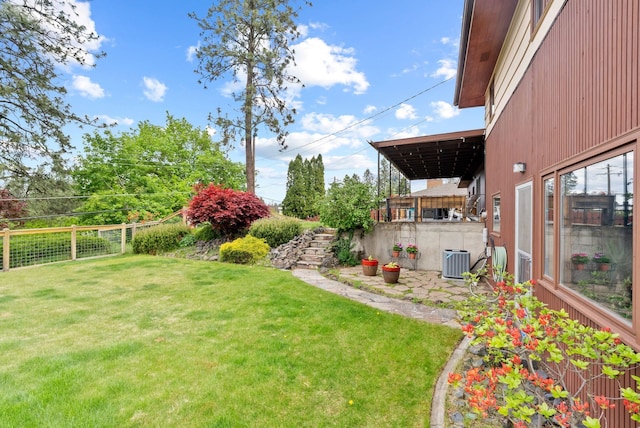 view of yard with central AC