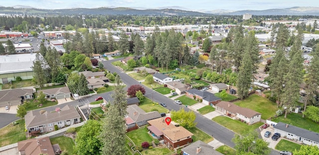 view of property location with mountains and nearby suburban area