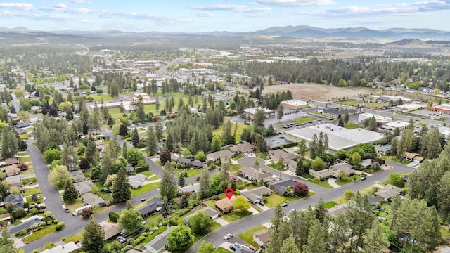aerial overview of property's location featuring a mountainous background
