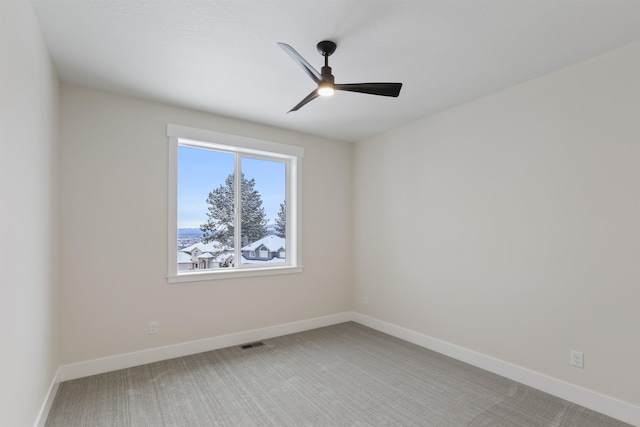 7285 E Columbia Dr, Spokane, WA 99212 - empty room with light carpet, ceiling fan, and baseboards