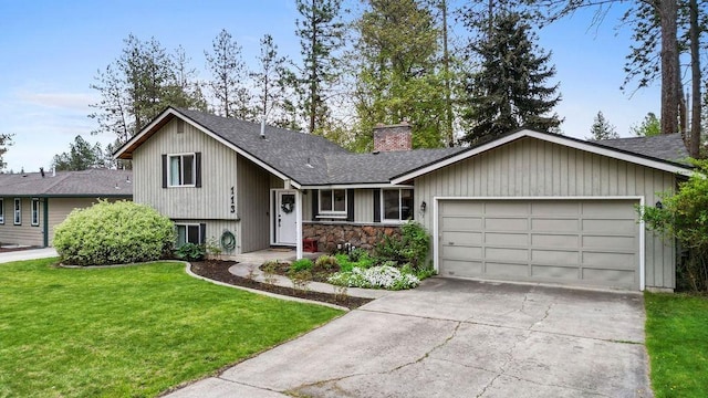 113 W Florence Ave, Spokane, WA 99218 - tri-level home with a shingled roof, an attached garage, a chimney, driveway, and a front yard