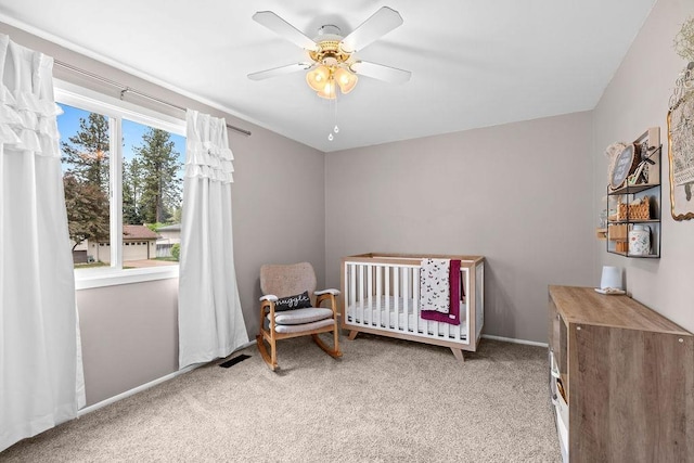 113 W Florence Ave, Spokane, WA 99218 - bedroom featuring carpet, a crib, a ceiling fan, and baseboards