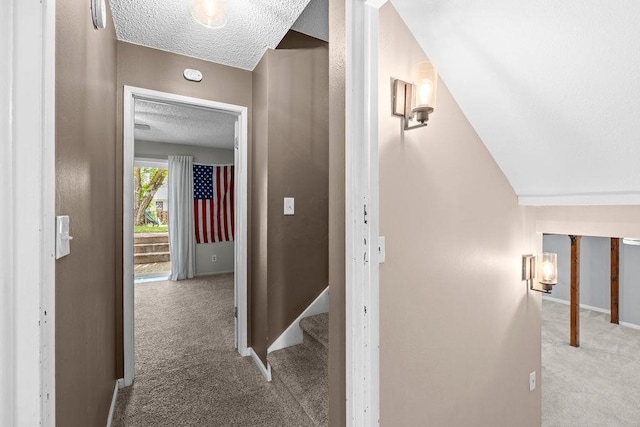 113 W Florence Ave, Spokane, WA 99218 - hallway with carpet, a textured ceiling, and baseboards