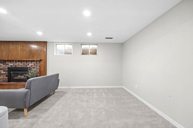 113 W Florence Ave, Spokane, WA 99218 - living room featuring light carpet, baseboards, a fireplace, and recessed lighting