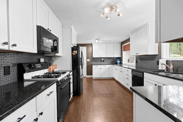 113 W Florence Ave, Spokane, WA 99218 - kitchen with black appliances, a sink, white cabinetry, and decorative backsplash