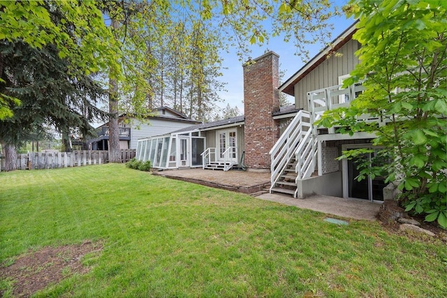 113 W Florence Ave, Spokane, WA 99218 - view of yard featuring a patio area, stairs, a sunroom, and french doors