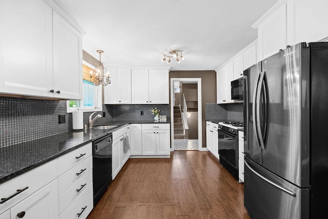 113 W Florence Ave, Spokane, WA 99218 - kitchen with black appliances, white cabinetry, and decorative backsplash