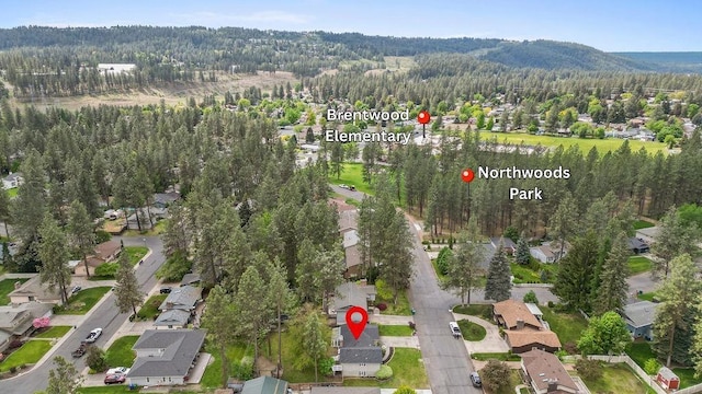 113 W Florence Ave, Spokane, WA 99218 - aerial view of property and surrounding area with a heavily wooded area and nearby suburban area