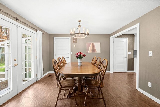 113 W Florence Ave, Spokane, WA 99218 - dining space featuring a chandelier, french doors, baseboards, and dark wood finished floors