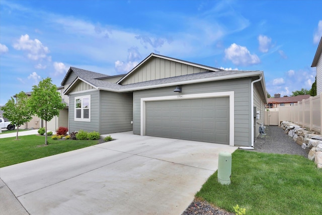 5704 W Jamestown Ln, Spokane, WA 99208 - single story home with board and batten siding, driveway, and a garage