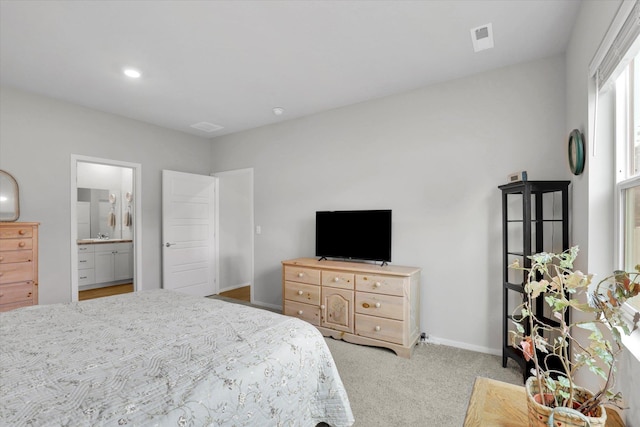 5704 W Jamestown Ln, Spokane, WA 99208 - carpeted bedroom with baseboards, connected bathroom, and recessed lighting