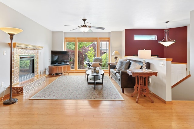 5229 S Altamont Ln, Spokane, WA 99223 - living room featuring wood-type flooring, a ceiling fan, a fireplace, and baseboards