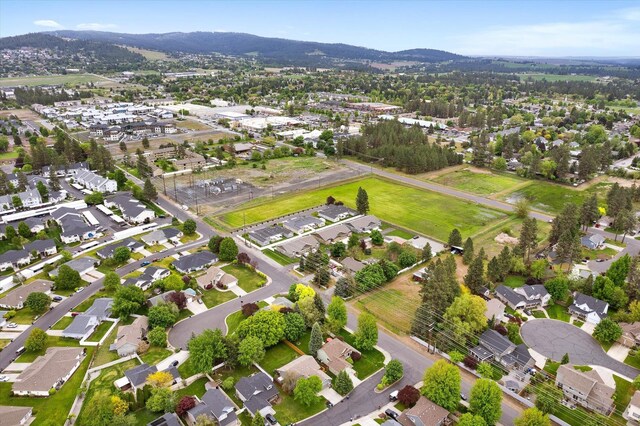 5229 S Altamont Ln, Spokane, WA 99223 - aerial view of property and surrounding area featuring a mountainous background and nearby suburban area