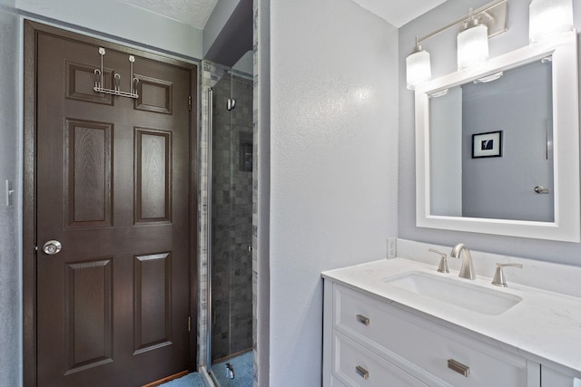 full bath with a stall shower and vanity