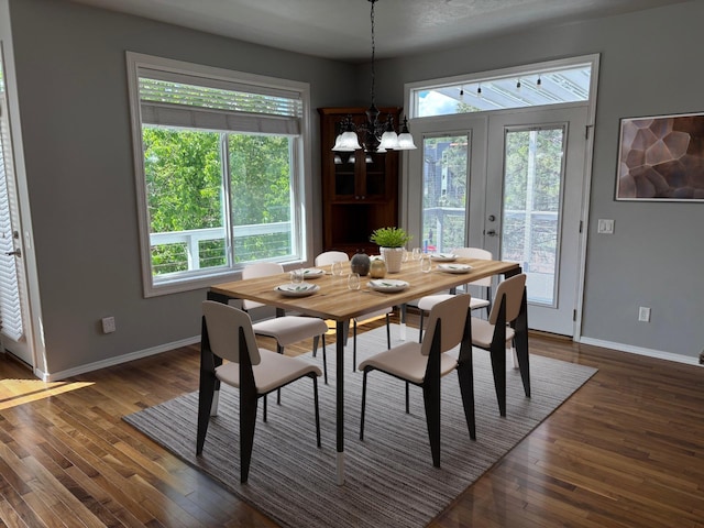 1746 W 14th Ave, Spokane, WA 99204 - dining area with baseboards, dark wood-style flooring, and a chandelier