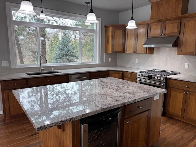 1746 W 14th Ave, Spokane, WA 99204 - kitchen with under cabinet range hood, a sink, wine cooler, stainless steel gas stove, and dark wood finished floors