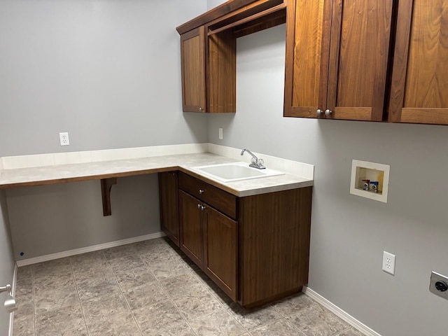 1746 W 14th Ave, Spokane, WA 99204 - laundry room featuring electric dryer hookup, hookup for a washing machine, cabinet space, baseboards, and light stone finish floors