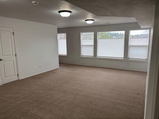 1746 W 14th Ave, Spokane, WA 99204 - unfurnished room featuring carpet floors, baseboards, a smoke detector, and a textured ceiling