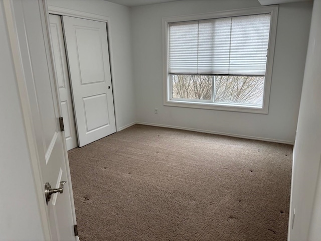 1746 W 14th Ave, Spokane, WA 99204 - unfurnished bedroom featuring carpet flooring, baseboards, and a closet