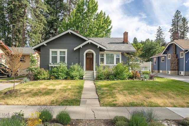 207 W 27th Ave, Spokane, WA 99203 - view of front of house featuring a front yard and a chimney