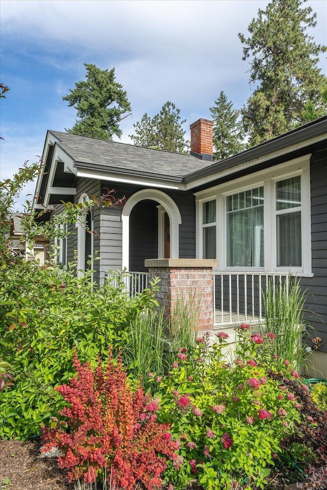 207 W 27th Ave, Spokane, WA 99203 - view of front of house with a chimney and covered porch