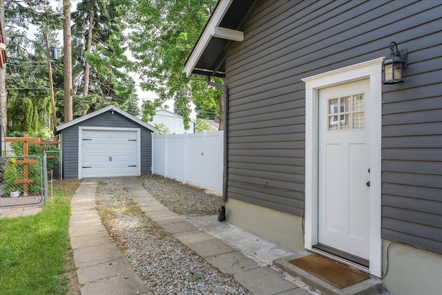 207 W 27th Ave, Spokane, WA 99203 - view of exterior entry featuring driveway and a detached garage