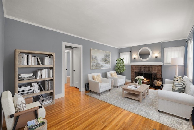 207 W 27th Ave, Spokane, WA 99203 - living room featuring wood finished floors, a fireplace, and crown molding