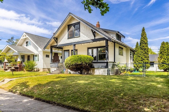 711 E Illinois Ave, Spokane, WA 99207 - view of front facade with a chimney and a porch