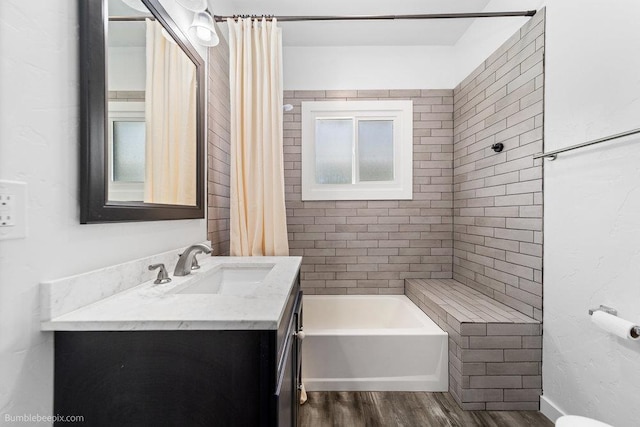 711 E Illinois Ave, Spokane, WA 99207 - bathroom with vanity, wood finished floors, and shower / bathtub combination with curtain