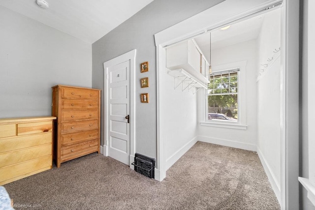 711 E Illinois Ave, Spokane, WA 99207 - unfurnished bedroom featuring carpet flooring, vaulted ceiling, and baseboards
