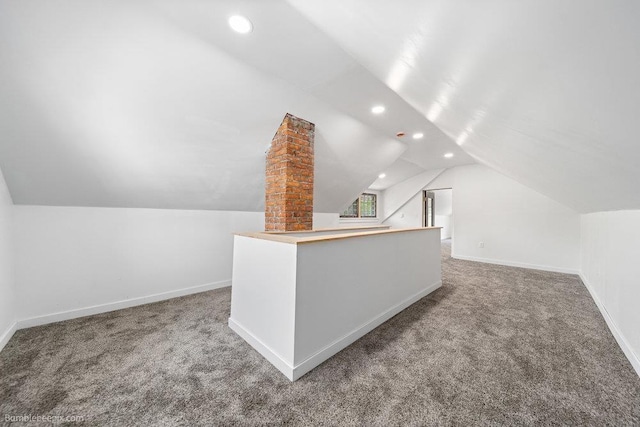 711 E Illinois Ave, Spokane, WA 99207 - additional living space with carpet flooring, recessed lighting, lofted ceiling, and baseboards