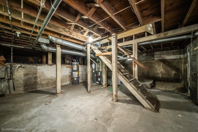 711 E Illinois Ave, Spokane, WA 99207 - unfinished below grade area with water heater, heating unit, and stairway