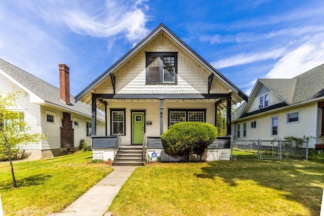711 E Illinois Ave, Spokane, WA 99207 - bungalow-style house with a porch and a gate