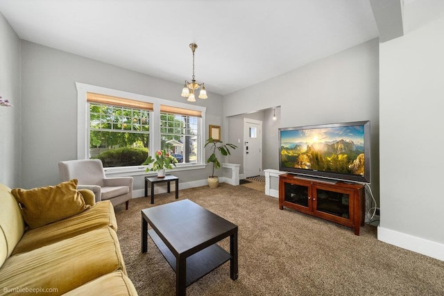 711 E Illinois Ave, Spokane, WA 99207 - living area featuring a chandelier, carpet floors, and baseboards