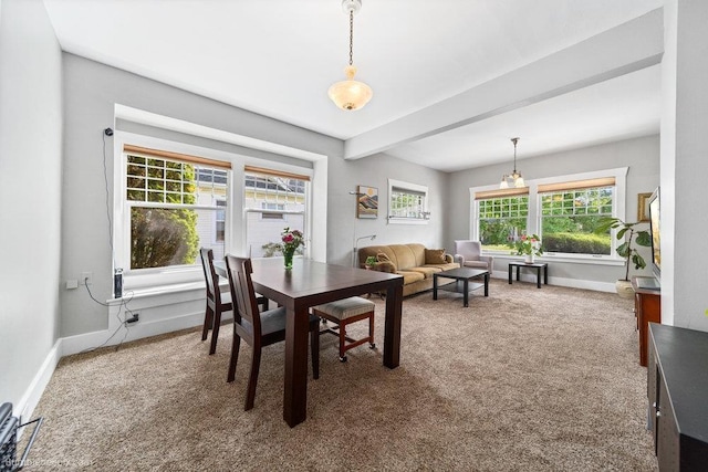 711 E Illinois Ave, Spokane, WA 99207 - carpeted dining room with baseboards and beam ceiling