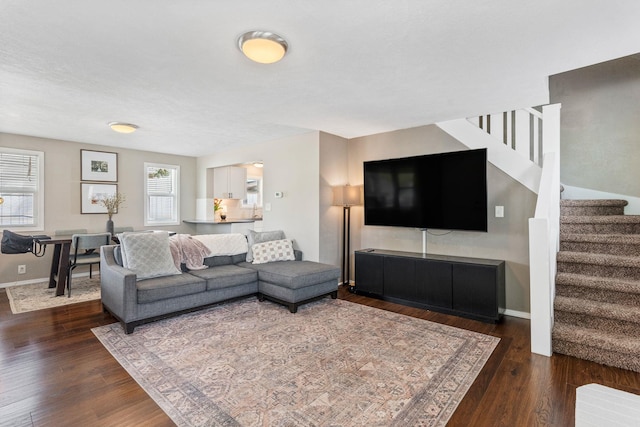 3214 E 29th Ave, Spokane, WA 99223 - living room with stairs, wood finished floors, and baseboards